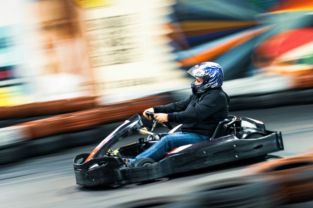 Driver in motion on track