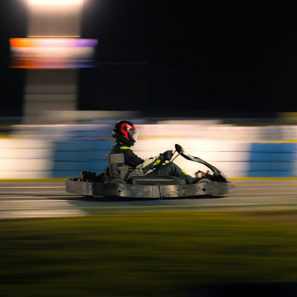 Kart at speed on track at night